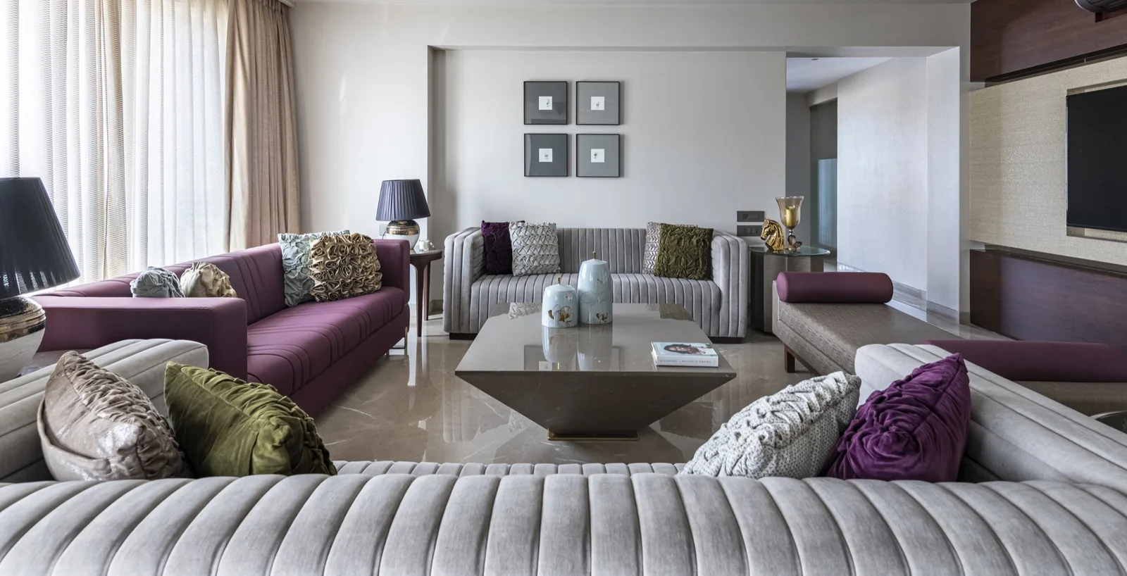 A Porcelain Sheer cushion styled in a layered neutral room
